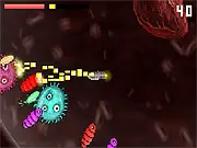 The Last Heart free retro shooter online game screenshot showing a nano robot defending a heart from alien creatures
