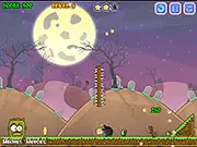 Screenshot of Bombing Zombies game showing a bomb exploding near a zombie in the cemetery