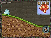 Slidy Caves free online game featuring a cave creature sliding down a tunnel and avoiding traps