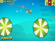 Trolling Lion Jump free online arcade game screenshot, featuring a cartoon lion jumping over large balls to collect floating food.