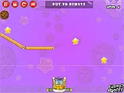 Willy Likes Cookies 2 game screenshot, a rolling cookie being guided by bubbles and wooden platforms toward a cartoon monster named Willy, physics puzzle game