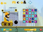 Building Cubes game screenshot showing a colorful match-3 puzzle grid alongside a partially built house with construction materials, illustrating the house-building goal