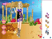 A woman wearing a beautiful, blue and green ethereal dress styled for a Deep Sea Dresses underwater party theme in the online game