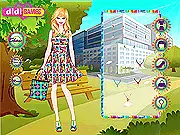 Screenshot of the Art School Prints dress-up game showing the character Chloe with a creatively designed, printed top and skirt, against an art studio background