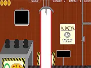 Screenshot of Ol' Dusty's Pizza Manufacturing Facility showing a conveyor belt of pizzas and a laser zapper used to eliminate imperfect pizzas