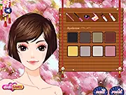 Screenshot of Sakura Blossom Festival game showing the two girls, Rukia and Orihime, wearing beautiful traditional Japanese kimonos under blooming sakura trees.