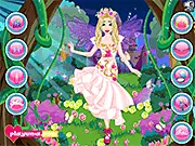 Screenshot of Elsa Fairy Dress Up game showing the princess wearing a green fairy dress with large sparkly wings and a new elegant hairstyle.