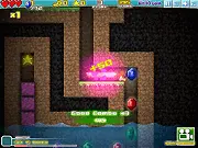 MineCaves online free puzzle game screenshot of character sliding to collect gems on PlayArcadeHub