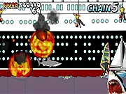 Screenshot of the Los Angeles Shark destruction game showing a giant shark jumping out of the ocean to attack a helicopter near the LA pier.