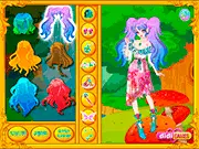 Screenshot of Fairy Queen dress up game showing the beautiful character with wings, a magical gown, and a floral crown in a forest setting.