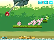 Angry Birds Kick Piggies free game screenshot, a red bird preparing to kick a green pig off a wooden platform