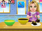 Screenshot of Baby Rapunzel Cake Balls Cooking game showing the princess mixing batter and decorating the finished cake balls.