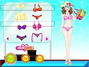 Mix & Match Bikinis game interface showing a model wearing a custom bikini and selecting sunglasses in the free online dress-up game