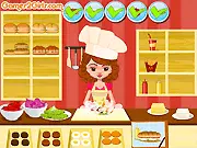 Burger Maker 2 game screen showing various burger ingredients and a chef preparing a customized burger order in the free online cooking game