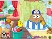 Pou Day Care game screenshot showing the Pou character happily covered in soap bubbles during a shower and a selection of new clothes