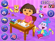 Screenshot of Dora's Reading Time game showing Dora dressed up and sitting at a newly decorated study table with books and school supplies