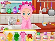 Baby Leo Bath Time Care game image showing a happy baby boy sitting in a kitchen sink full of bubbles