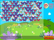 Butterfly Bubble Shooter free online game screenshot showing an arrow aiming a yellow butterfly bubble towards a cluster of matching bubbles to create a pop, with a nature-themed background
