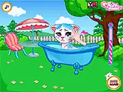 Screenshot of the Magic Kitty Caring & Dress Up free online game showing Linda and the magical cat in a sparkling prom dress selection scene