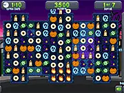 Tricky Treats free online Match 3 puzzle game screenshot showing various colorful treats and skull items on the game board