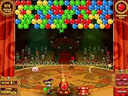 Screenshot of Circus Pop game showing a cannon ready to shoot a colored bubble at a cluster hanging from the circus tent roof.