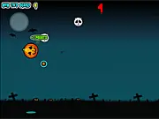 Screenshot of the Happy Halloween Champion free online arcade game showing the bouncing pumpkin hitting spooky skull targets