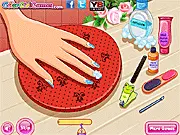 The 'Frozen Back to School Nails Design' game screen showing a close-up of fingernails decorated with light blue polish, glitter, and snowflake decals.