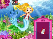 Screenshot of Dora Mermaid Princess game showing Dora dressed in a brightly colored mermaid tail and top with accessories