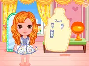 Design My Baby's Outfit free online game showing a cute baby girl model wearing a newly designed and accessorized custom outfit