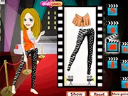 Screenshot of the Best Actress Dress Up game showing actress Lessie Trudy on a red carpet background, ready to be styled in a glamorous evening gown, play free online game