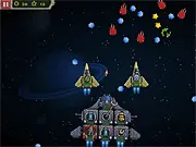 Gameplay screenshot of Galaxy Siege 2 showing a heavily armed custom spaceship flying through space while battling alien enemies and collecting valuable resources.