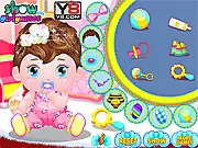 Free online baby care and dress-up game featuring a smiling baby girl (Shelly) wearing a cute outfit and holding a colorful toy.