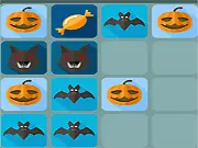 Screenshot of the 2048 Halloween Flash puzzle game board, showing several spooky-themed tiles like pumpkins and ghosts merged into various stages on the grid.