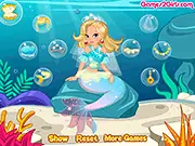 The free online dress up game Mermaid Wedding Flash showing a mermaid bride with a beautiful, ornate wedding outfit in an underwater setting.