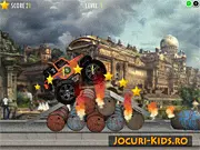 Screenshot of the Urban Crusher 3 game, showing a large red monster truck jumping over ramps and stacked cars on an urban-themed obstacle course.