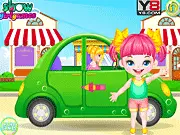 Screenshot of the Cute Baby Picnic preparation game showing a mother packing a picnic basket with cakes, fruit, and baby supplies for a day out in the nature park. Play this free online game.