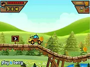 Screenshot of the online game Truck Champ, showing a monster truck driving fast over hills and collecting gold coins in a side-scrolling view
