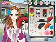 Spanish Girl Makeup free online game screenshot showing Lily in a beautiful Spanish costume with a dress, red roses, and a hand fan.