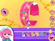 Pony Friendship Jewelry Maker free online game image showing a custom-designed necklace with pony charms and colorful, sparkling gemstones on PlayArcadeHub.