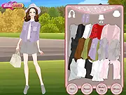 Loose Coats free online dress up game featuring a model in a stylish, oversized beige coat, boots, and a scarf, demonstrating fall fashion on PlayArcadeHub.