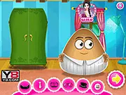 The adorable Pou girl and Pou groom standing in their wedding attire from the Pou Wedding Party Dress Up game
