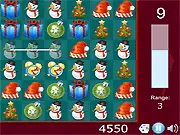 Xmas Puzzle Mania free online game screenshot, showing a board filled with Christmas-themed match-3 puzzle items
