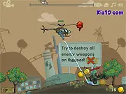HeliCrane 2 Bomber free online game screenshot, military helicopter firing weapons at a terrorist car on a road, action gameplay