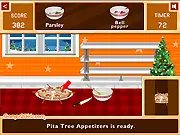 Gameplay screen of Cooking Passion: Christmas Party showing cookies, appetizers, and a mug of hot chocolate being prepared.