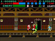 The character Santa Claus performing a flying kick against an enemy elf in the side-scrolling beat 'em up game Santa Fu