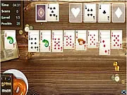 Screenshot of Wild West Solitaire card game showing a Klondike tableau layout with themed cards and background