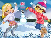 Alaskan Snowball Fun dress up game screenshot showing two stylish sisters in warm winter jackets and gear in the snow