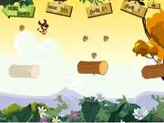 Screenshot of Adventure of Boodoo free online game, showing the character Boodoo jumping between two floating wooden logs to collect nuts.