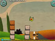 Aliens in a Box online puzzle game screenshot, little green alien, removing blocks to reach a box, physics puzzle game
