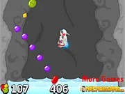 Astro Jump free online arcade game showing Astro Boy collecting gems and a rocket in a dark cave